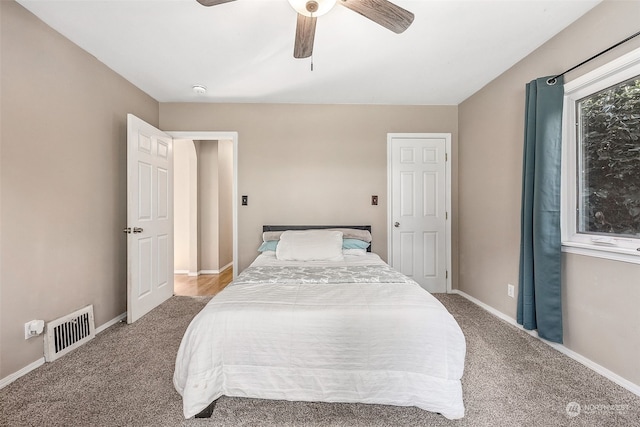 carpeted bedroom with ceiling fan