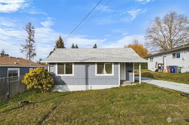 bungalow with a front lawn