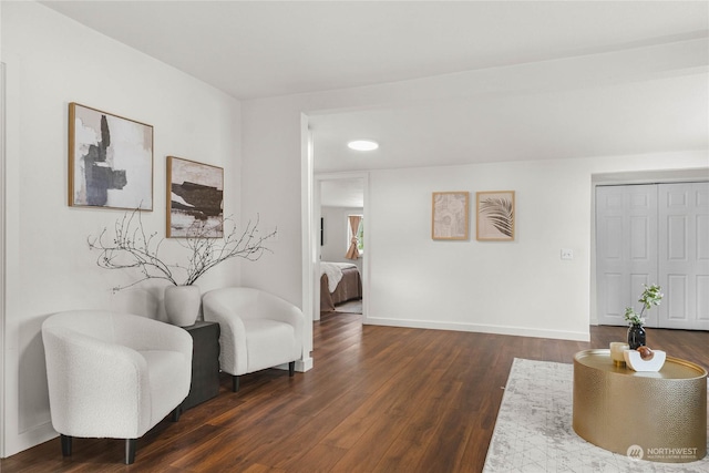 sitting room with dark hardwood / wood-style floors