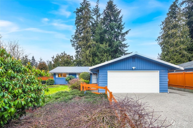 ranch-style home featuring a garage