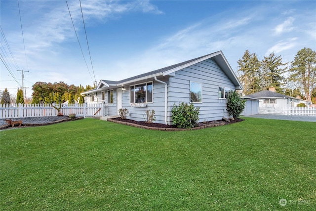 view of side of property with a lawn