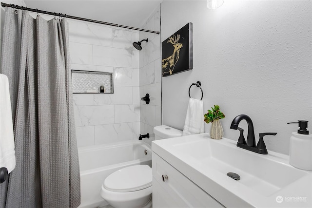 full bathroom with vanity, shower / bath combo with shower curtain, and toilet