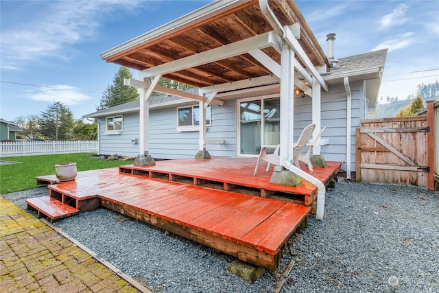 exterior space with a deck and a lawn