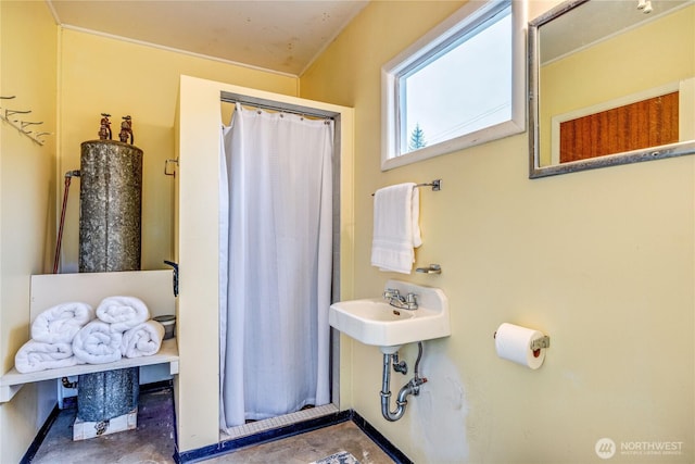 bathroom featuring concrete floors and a sink