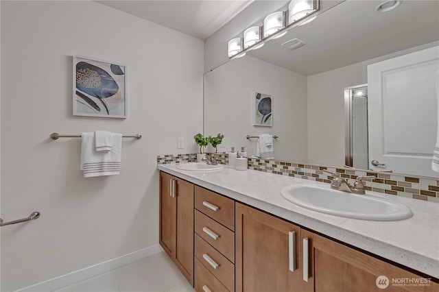 full bathroom with double vanity, a sink, and decorative backsplash