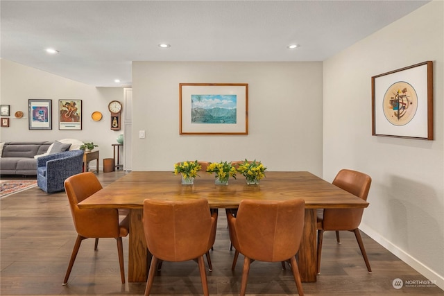 dining area with dark hardwood / wood-style floors