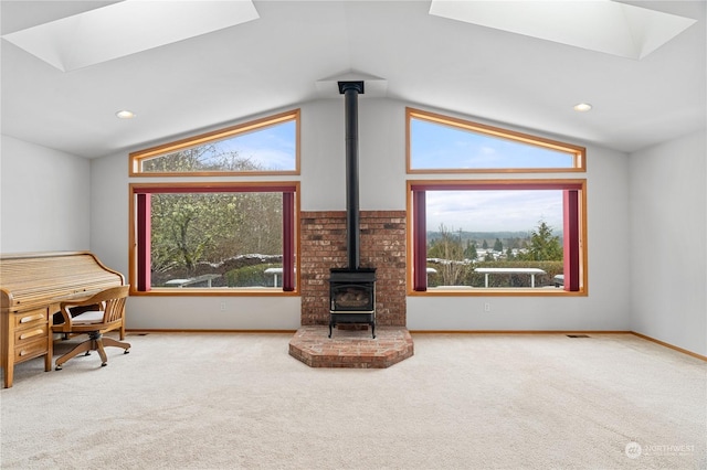 912 Bell Dr, Cosmopolis, WA 98537 - living room with a wealth of natural light, a wood stove, and carpet flooring