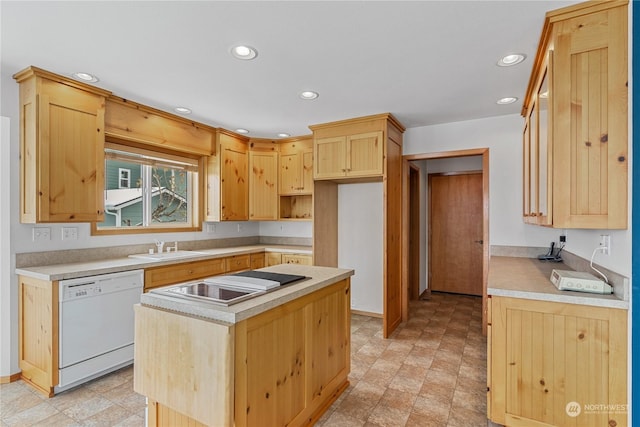 912 Bell Dr, Cosmopolis, WA 98537 - kitchen with light brown cabinetry, white dishwasher, a sink, and recessed lighting