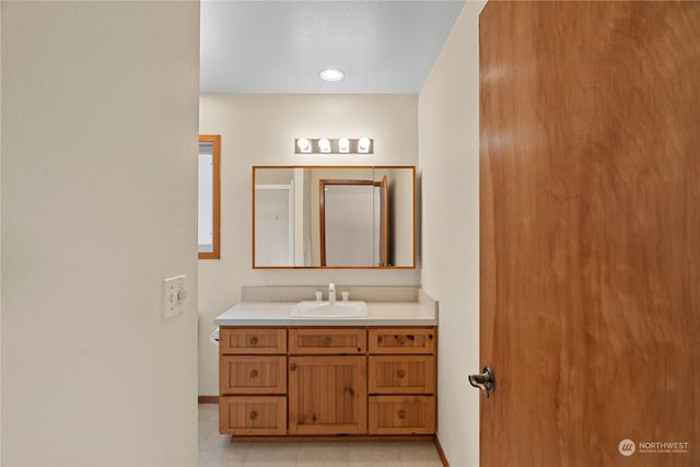 912 Bell Dr, Cosmopolis, WA 98537 - bathroom with an enclosed shower, vanity, baseboards, and tile patterned floors