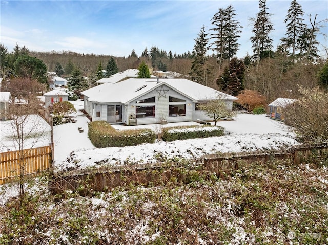 912 Bell Dr, Cosmopolis, WA 98537 - snow covered back of property with fence and a wooded view