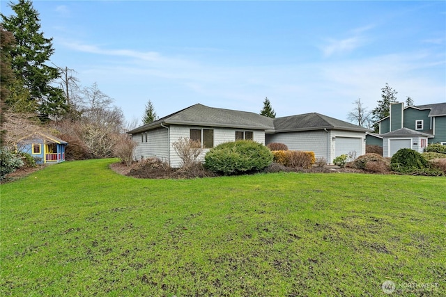 view of front of house with a garage and a front yard