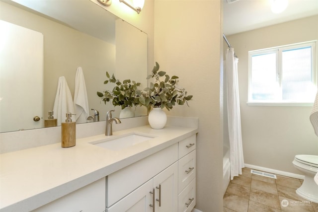 full bathroom with vanity, shower / bath combination with curtain, and toilet