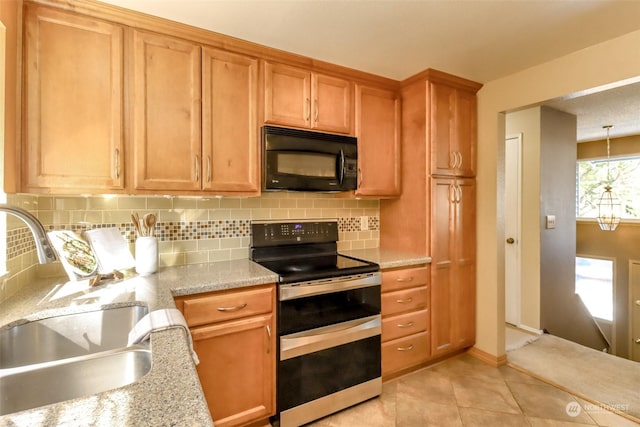 kitchen with sink, light tile patterned floors, double oven range, light stone countertops, and decorative backsplash