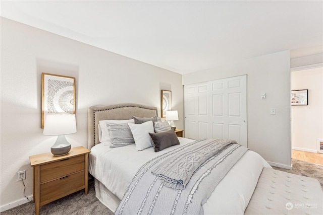 carpeted bedroom featuring a closet