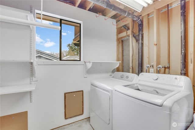 laundry area featuring washing machine and clothes dryer