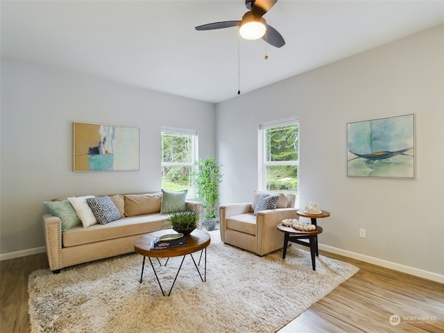 living room featuring hardwood / wood-style flooring and ceiling fan