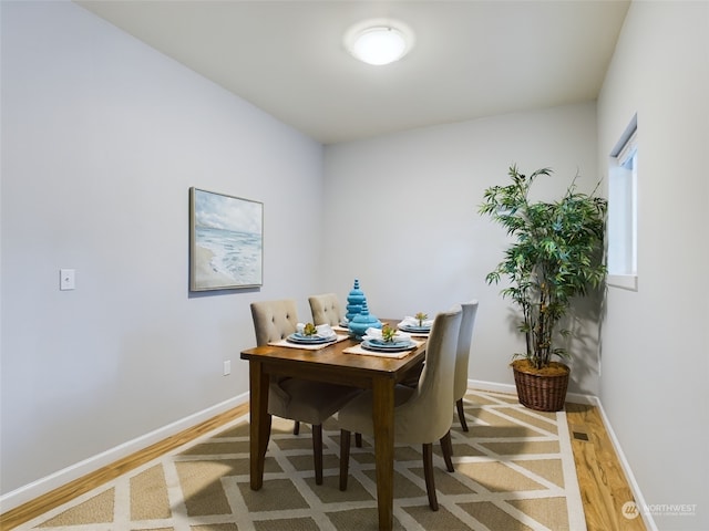 dining room with hardwood / wood-style floors