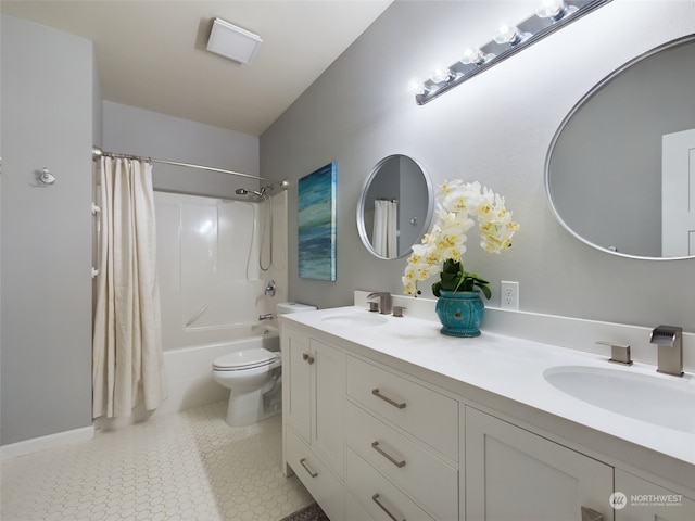 full bathroom with vanity, shower / bath combination with curtain, tile patterned floors, and toilet