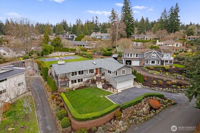 birds eye view of property with a residential view