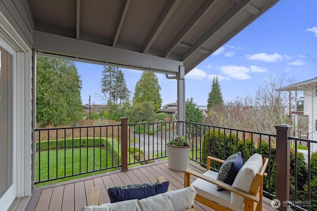 wooden terrace featuring an outdoor hangout area