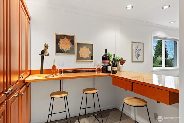 bar with crown molding, wet bar, and recessed lighting