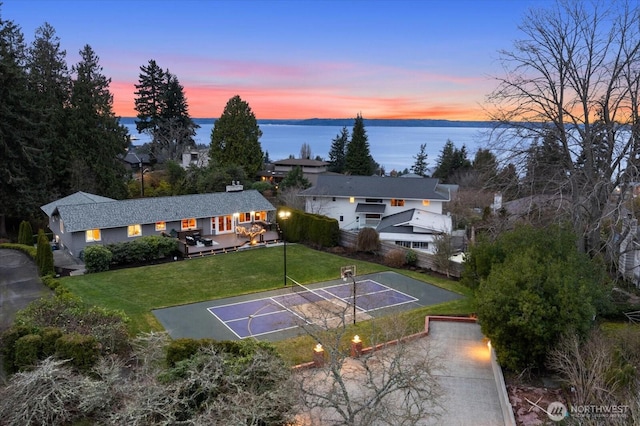 aerial view at dusk with a water view