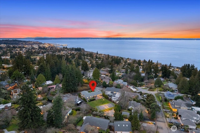 aerial view featuring a water view and a residential view