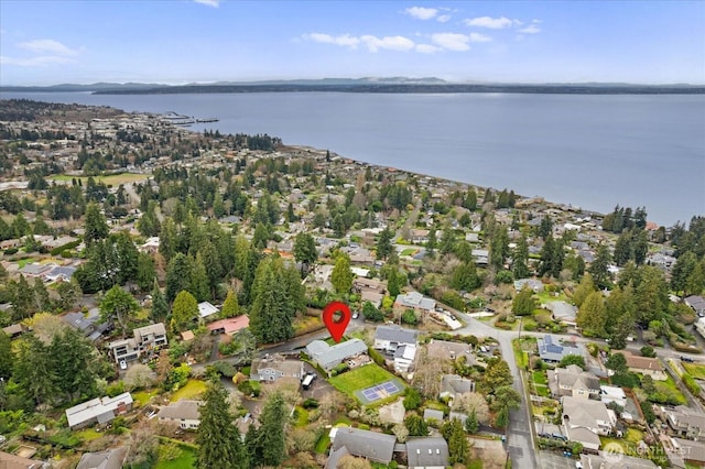 bird's eye view featuring a water view and a residential view