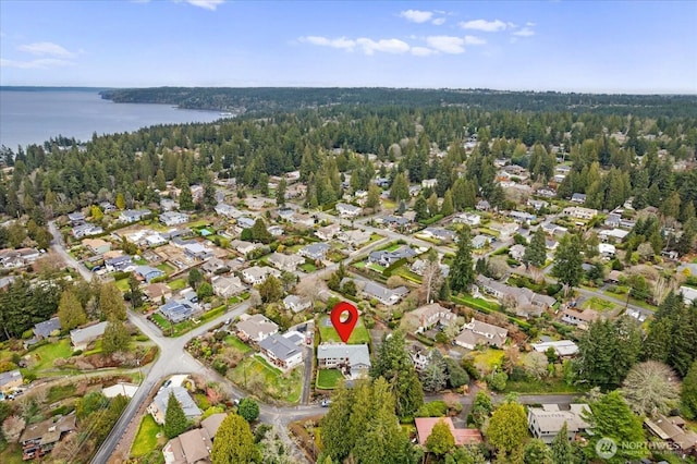 aerial view featuring a water view, a residential view, and a view of trees