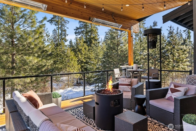 exterior space with an outdoor living space with a fire pit