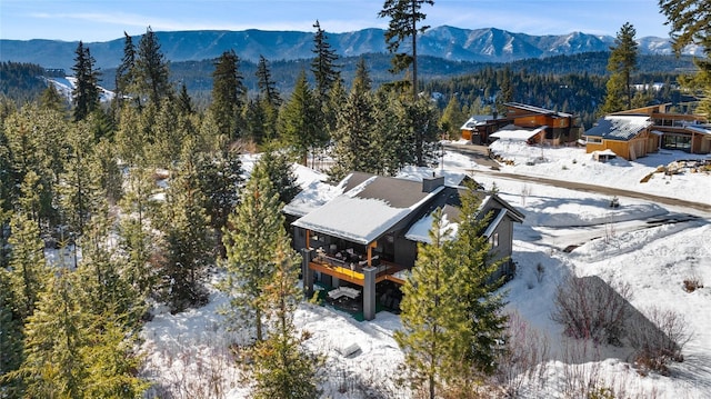 snowy aerial view with a mountain view