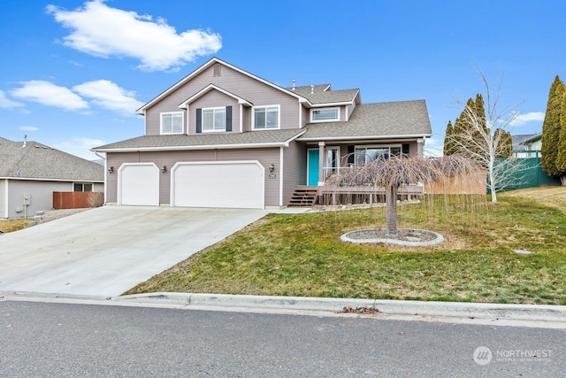 view of front property featuring a garage and a front lawn