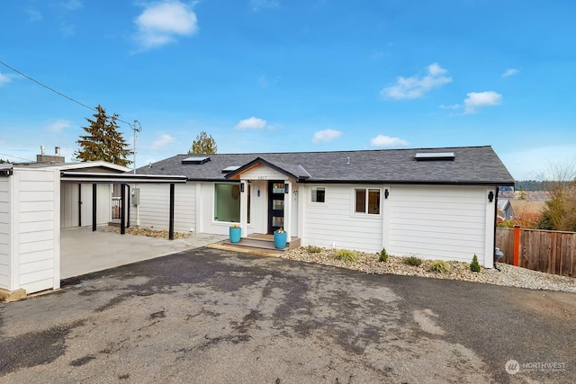 ranch-style home with a carport