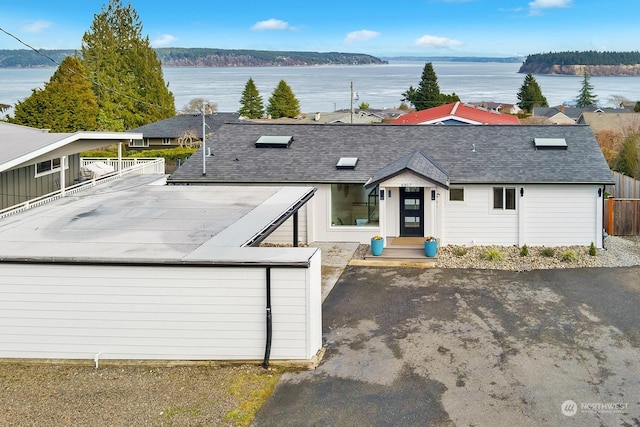 view of front of home featuring a water view