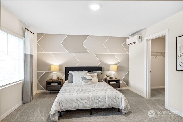 carpeted bedroom with an AC wall unit and a spacious closet