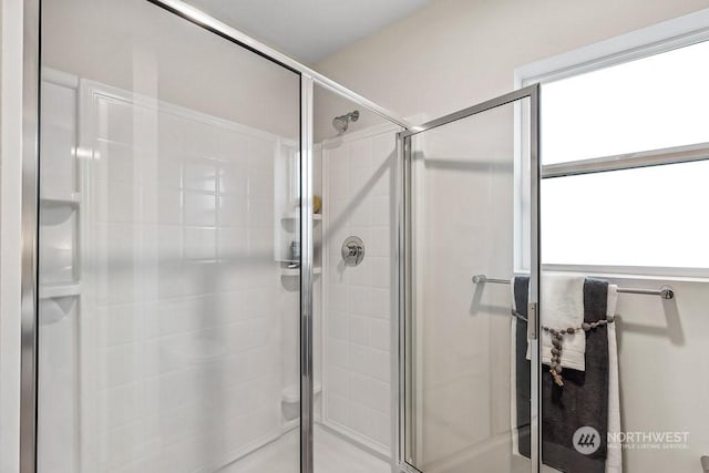 bathroom with a shower with shower door