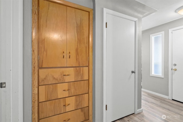 hall with light wood-type flooring