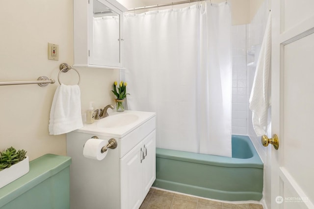 full bathroom featuring tile patterned floors, vanity, toilet, and shower / bath combination with curtain