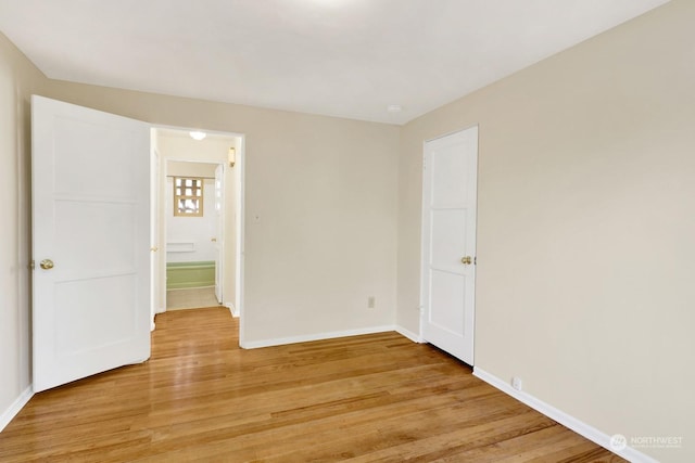 unfurnished room featuring light hardwood / wood-style floors