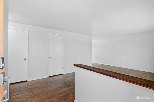 hall with dark hardwood / wood-style floors