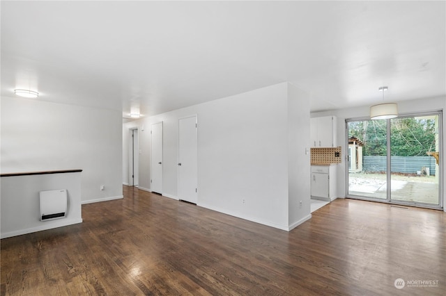 unfurnished room with dark hardwood / wood-style flooring