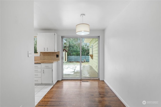 doorway to outside with light hardwood / wood-style floors