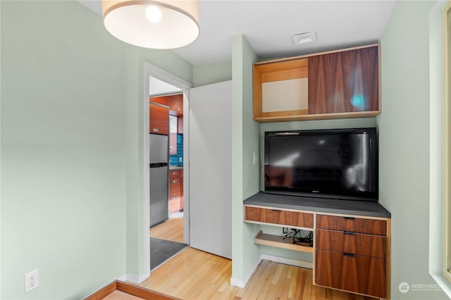 living room with light hardwood / wood-style flooring