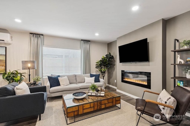 living room with wood-type flooring and a wall unit AC