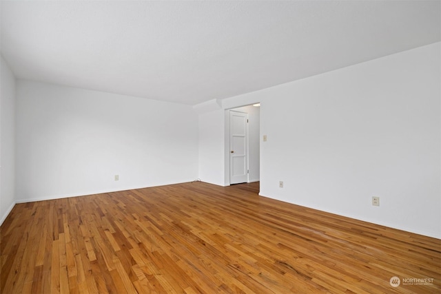 empty room featuring wood-type flooring