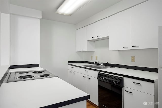 kitchen featuring sink, white cabinetry, light hardwood / wood-style flooring, white electric stovetop, and dishwasher