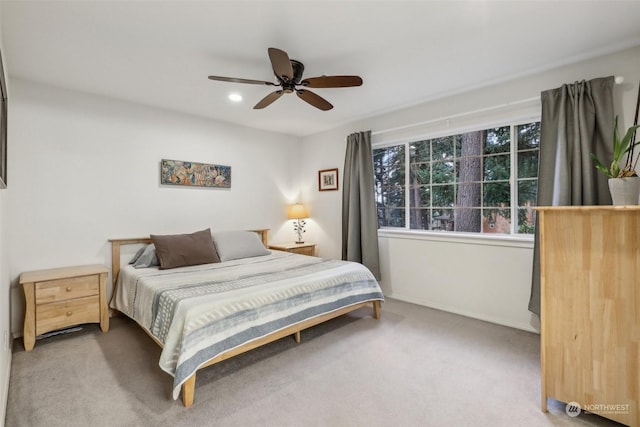 carpeted bedroom featuring ceiling fan