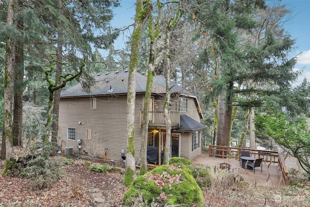 back of house featuring a patio area and central air condition unit