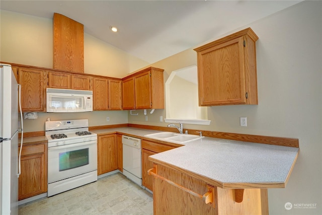 kitchen featuring lofted ceiling, sink, a kitchen breakfast bar, kitchen peninsula, and white appliances