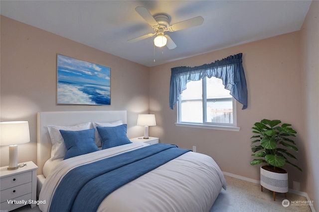 bedroom featuring ceiling fan and light colored carpet